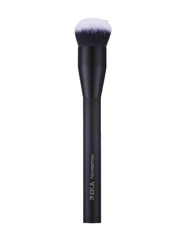 INIKA Foundation makeup brush with a simple black handle and dense rounded bristles fading from dark graphite to white tips.