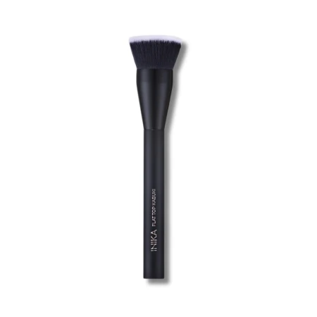 INIKA Organic makeup brush with a black handle and dense flat-top bristles in dark shades with lighter tips.