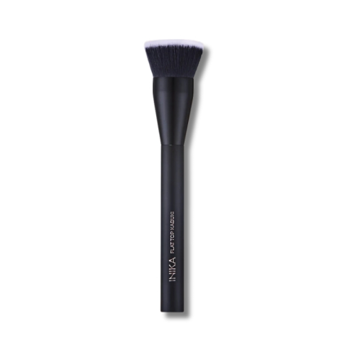 INIKA Organic makeup brush with a black handle and dense flat-top bristles in dark shades with lighter tips.