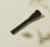 INIKA Organic flat-top brush with an elegant black handle and dense flat bristles, shown on a light beige background.