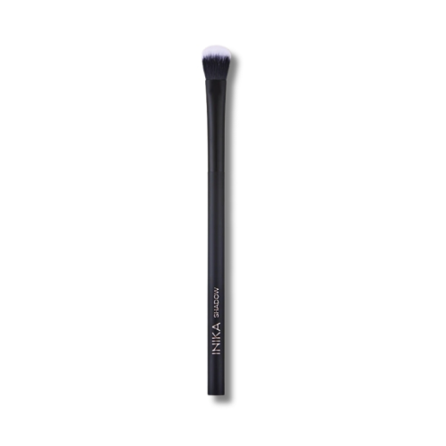 Single INIKA Organic eyeshadow brush with a slim matte black handle marked INIKA EYESHADOW for applying eyeshadow.