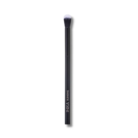 INIKA Organic Blending Brush, a slim black brush with a long handle and soft rounded black-and-white bristles for blending eyeshadow.