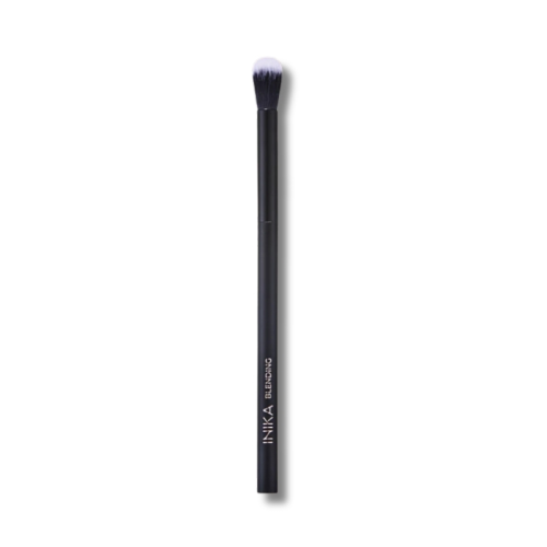 INIKA Organic Blending Brush, a slim black brush with a long handle and soft rounded black-and-white bristles for blending eyeshadow.