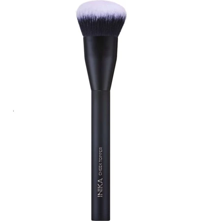 INIKA Organic Cheek Topper Brush with dense soft rounded synthetic bristles and an elegant matte black handle.