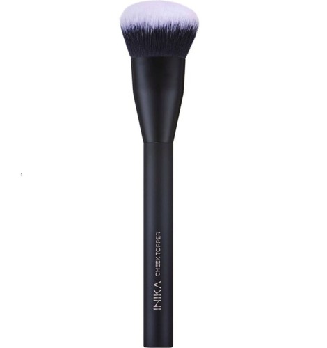 INIKA Organic Cheek Topper Brush with dense soft rounded synthetic bristles and an elegant matte black handle.