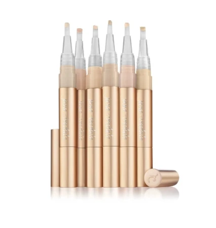 Set of Jane Iredale Active Light brightening concealers in gold brush-pen packaging.
