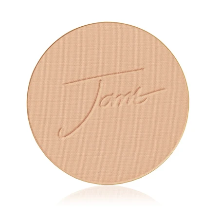 Pressed mattifying powder refill for a reusable compact, round with a smooth velvety surface and subtle jane iredale logo embossing.
