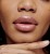 Jane Iredale lip gloss in a subtle natural shade with a satin glossy finish.