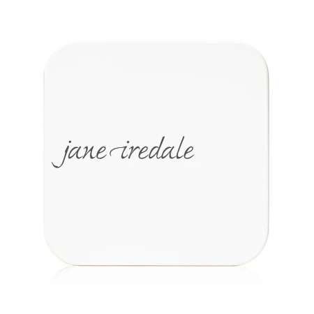 Closed white Jane Iredale refillable powder compact with minimalist elegant design and brand logo.