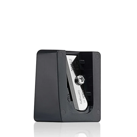 Black makeup pencil sharpener with transparent cover and visible blade.