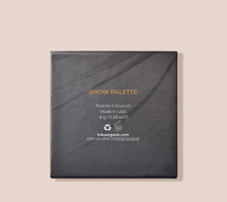 Back of INIKA Organic Brow Palette packaging with minimalist black design and gold text.