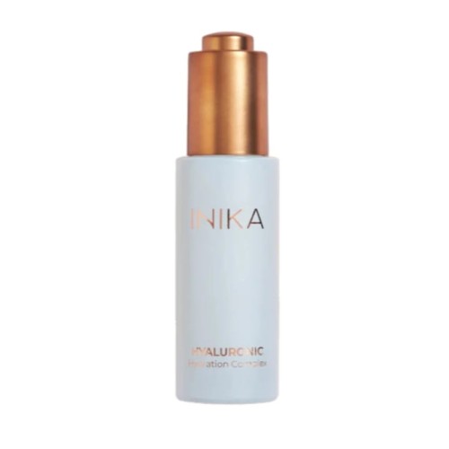 INIKA Organic Hyaluronic Hydration Complex serum in a slim light blue bottle with a metallic gold pump and rose-gold INIKA lettering.