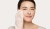 Woman gently cleansing her face with the Jane Iredale Magic Mitt.