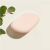 Pale pink latex-free makeup sponge with curved shape for precise foundation and powder application.