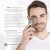 Smiling man holding ENVIRON DF Mobile Device near his face with benefit text beside him.