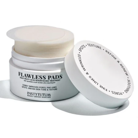 Open INSTYTUTUM Flawless Pads jar showing round saturated exfoliating pads inside.