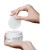 Hands reaching for a single INSTYTUTUM Flawless Pad from the jar.