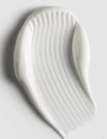 Creamy white ENVIRON Super Moisturiser texture sample spread on a grey surface.