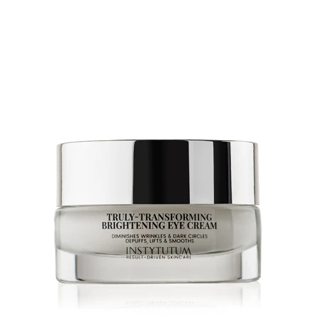 Glass INSTYTUTUM Truly-Transforming Brightening Eye Cream jar with mirrored metallic lid.