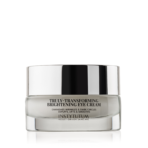 Glass INSTYTUTUM Truly-Transforming Brightening Eye Cream jar with mirrored metallic lid.