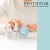 Woman holding an open blue INSTYTUTUM cream jar beside Flawless Brightening C-Serum and Super Serum bottles.