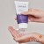 Hands squeezing clear ENVIRON Sebu-Wash Gel from the tube into the palm.