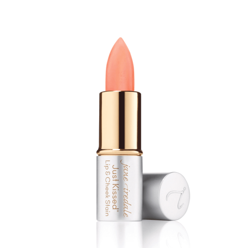 Jane Iredale Just Kissed Lip & Cheek Stain Forever Pink mini in silver and gold packaging with the peach-pink stick exposed.