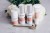 Environ Focus Care Radiance products on a marble surface with flowers and a gold Roll-CIT in front.