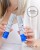 Woman holding two Environ Youth EssentiA products with Peptides Intelligently Combined message.