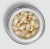 Top view of an open ENVIRON Hydrating Oil Capsules jar filled with pearly capsules.