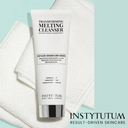 INSTYTUTUM Transforming Melting Cleanser tube on a white towel against a mint background.
