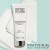 INSTYTUTUM Transforming Melting Cleanser tube on a white towel against a mint background.