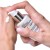 INSTYTUTUM Anti-Wrinkle Brightening C-Serum being dispensed onto the hand from a pump bottle.