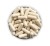 Open supplement tin with visible beige capsules arranged in layers.