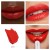 Poppy shade of Jane Iredale ColorLuxe lipstick in a vivid warm red with orange undertone.