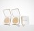 Jane Iredale refillable compacts in gold and white with minimalist design and powder inside.