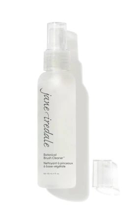 Open Jane Iredale Botanical Brush Cleaner bottle for cleaning makeup brushes.