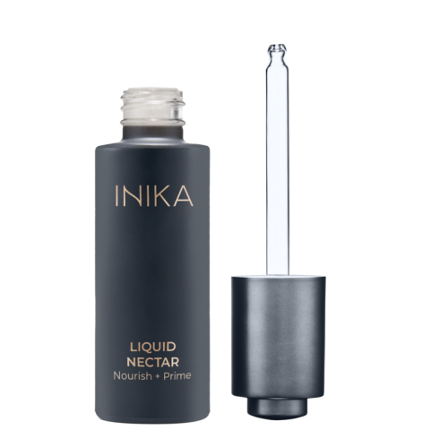 INIKA Organic Liquid Nectar Nourish + Prime bottle in matte dark packaging with gold lettering and dropper.
