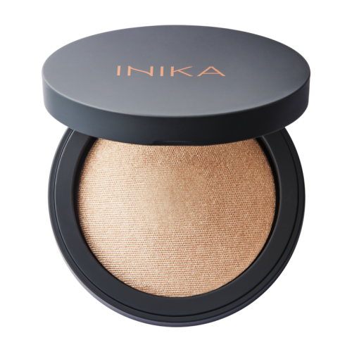 INIKA Organic Baked Mineral Illuminisor DEWDROP in an elegant black compact with a golden pearlescent finish.