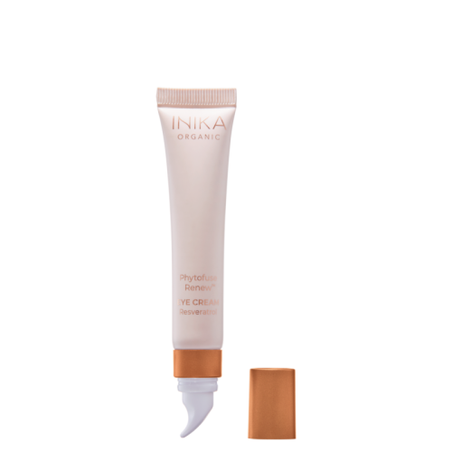 INIKA Organic Phytofuse Renew Eye Cream tube with sculpted cooling applicator in soft pink and copper packaging.