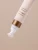 Close-up of the INIKA Organic Phytofuse Renew Eye Cream tube tip with white massage applicator.