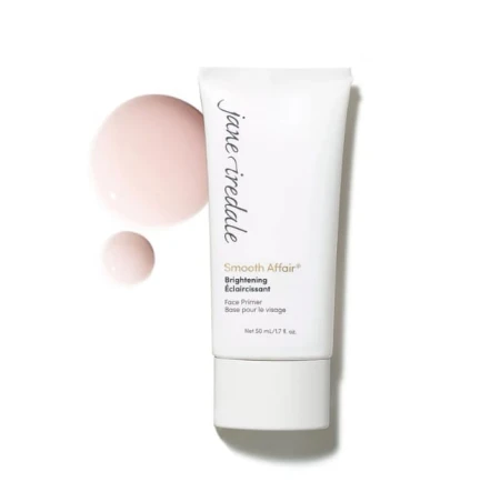 Jane Iredale Smooth Affair Brightening in a 50 ml white tube with a pink shade and creamy texture shown beside it.