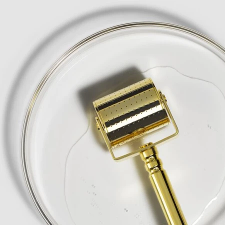 Gold Roll-CIT roller head soaking in Environ Instrument Cleaning Solution.