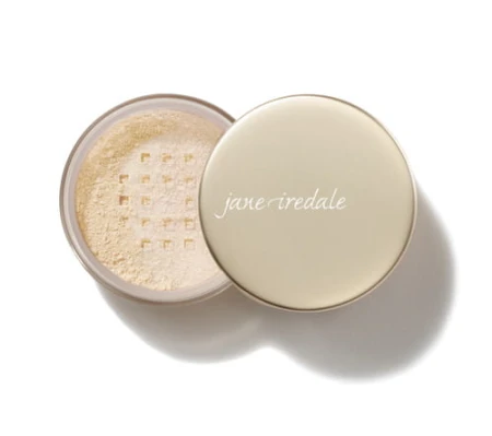 Jane Iredale Amazing Base loose mineral powder in an open jar with pearly gold lid.