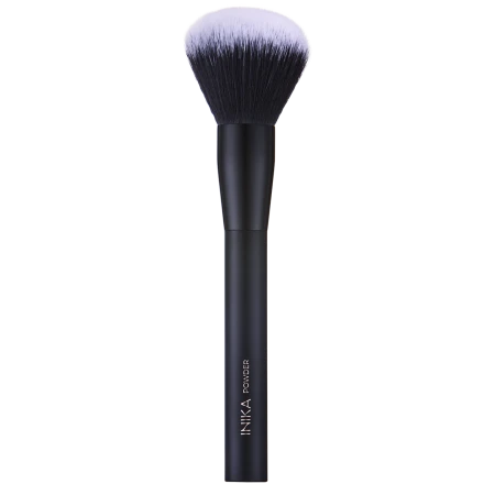 INIKA Organic Powder Brush with a matte black handle, gold INIKA POWDER lettering and a large dense rounded brush head.