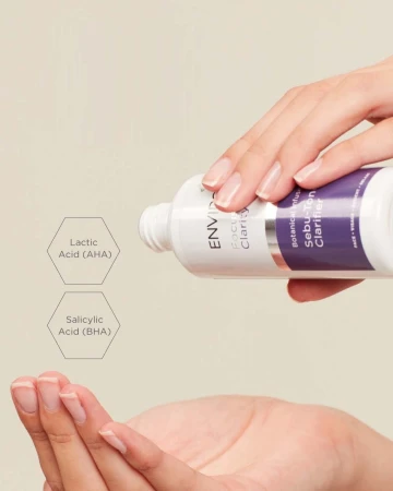 Hands pouring ENVIRON Sebu-Tone Clarifier from the bottle into the palm with AHA and BHA information beside it.