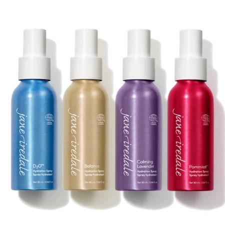 Four Jane Iredale hydration setting sprays shown side by side: POMMISST, BALANCE, D2O and Lavender.