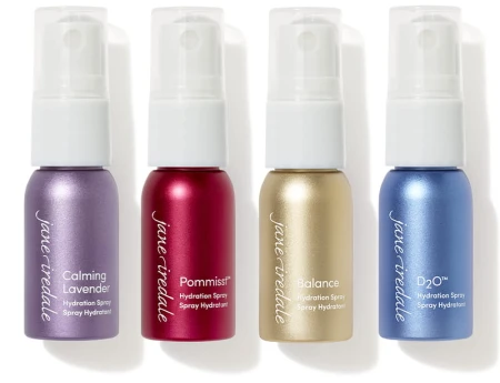Four Jane Iredale mini hydration setting sprays shown side by side: POMMISST, BALANCE, D2O and Lavender.