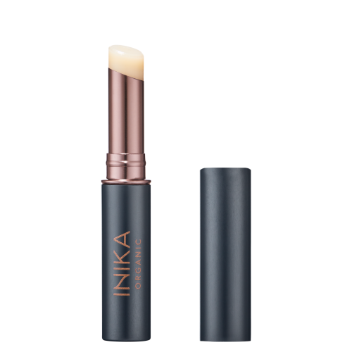 INIKA Organic lip balm stick in a dark graphite matte package with rose-gold detail and a natural clear balm tip.