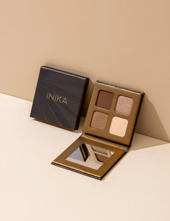 Open INIKA Organic Quad Eyeshadow Palette WIND showing four neutral beige and brown shades.